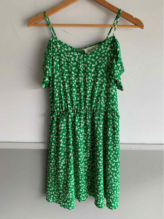 Green floral off-shoulder dress with ruffle neckline and adjustable straps.