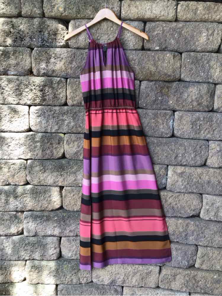 Sleeveless color block maxi dress with purple, pink, red, and brown horizontal stripes, gathered waist, and adjustable.