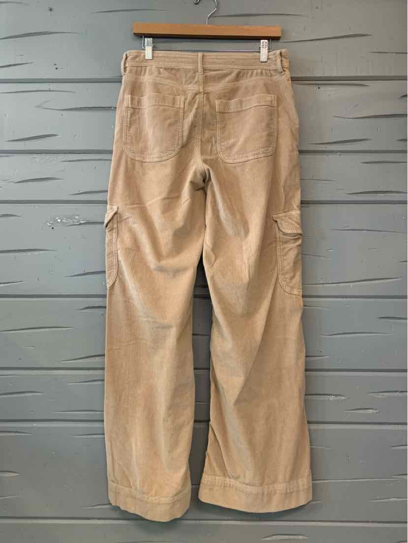 Tan American Eagle wide-leg pants with a solid finish, belt loops, and front pockets, displayed on a hanger.