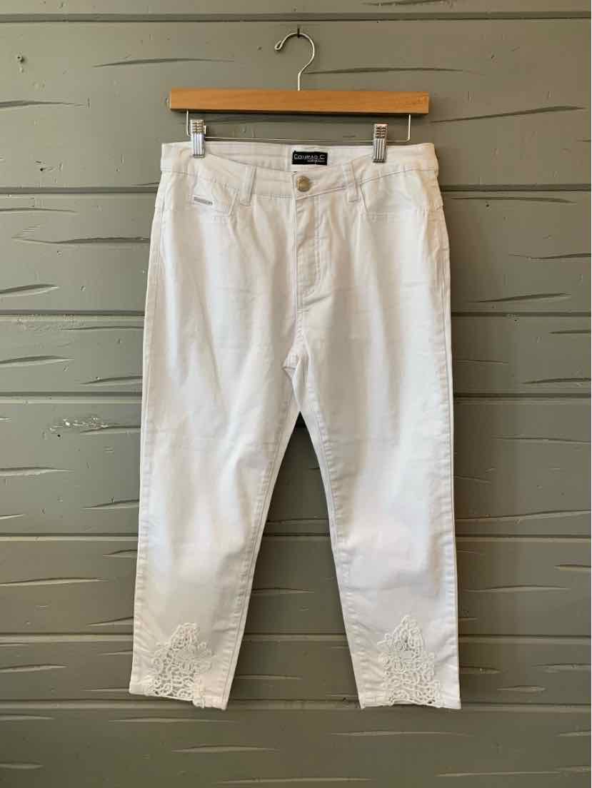 White cropped pants with front button and zipper, belt loops, and a slim fit.