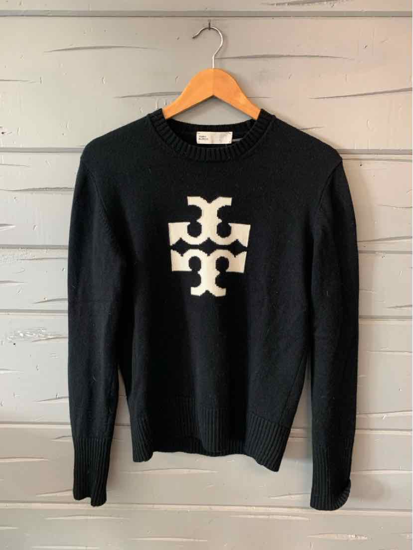 Black long-sleeve sweater with white Tory Burch logo centered on front.