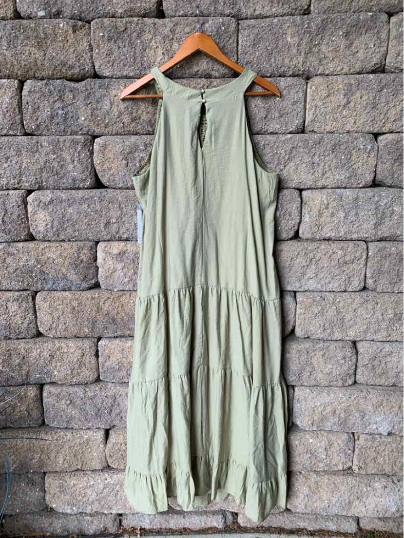Sleeveless olive green maxi dress with tiered skirt and keyhole neckline on wooden hanger.
