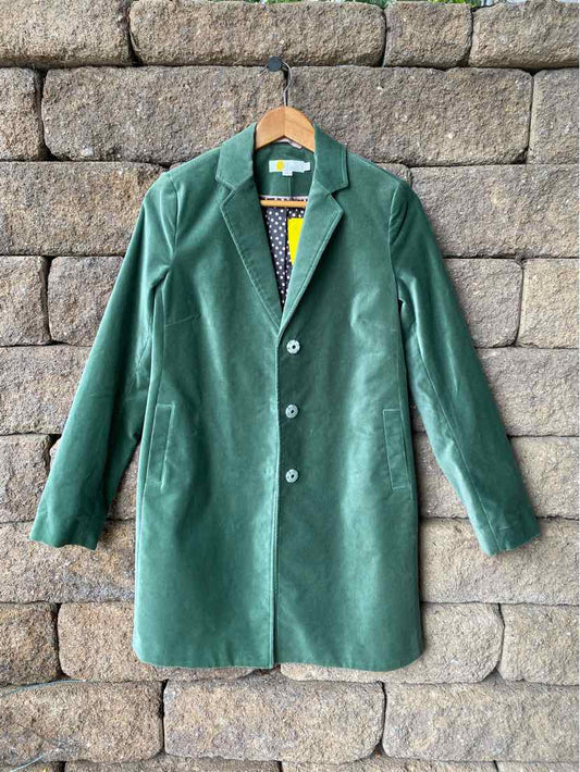 Green knee-length wool coat with notched collar and three-button front closure.