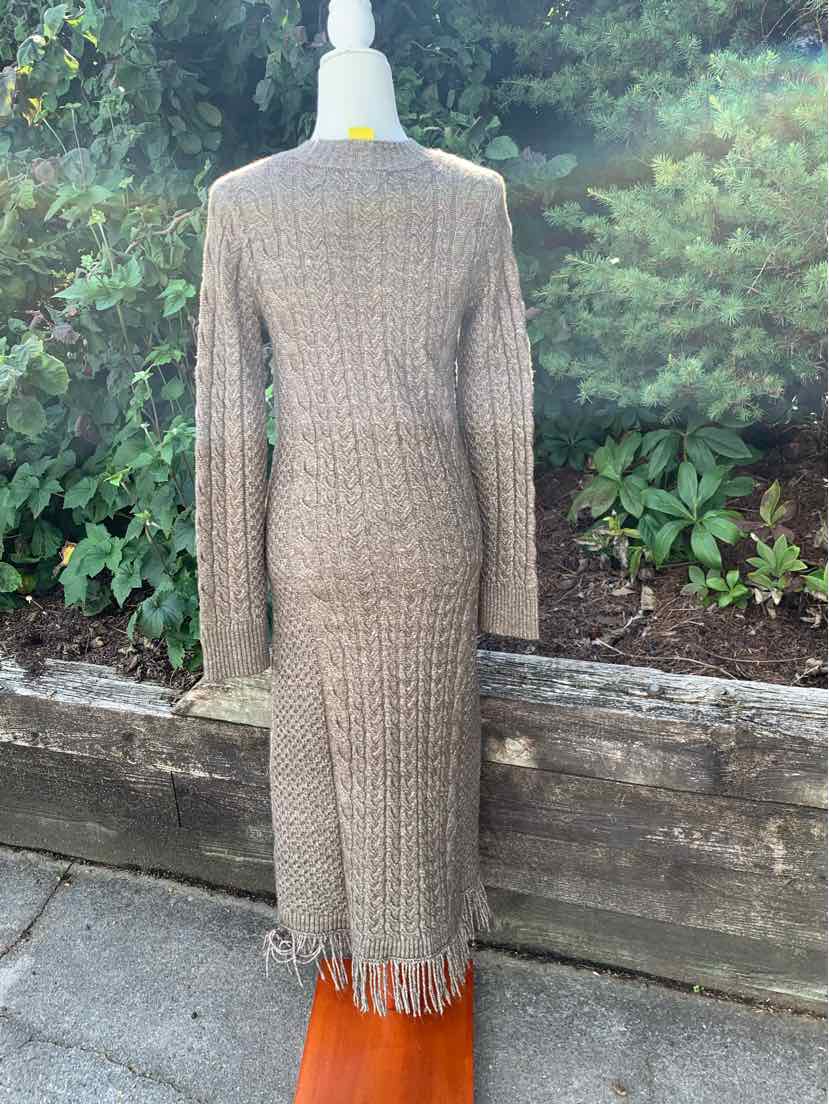 Beige knitted long-sleeve midi dress with a ribbed texture and fringe hem.