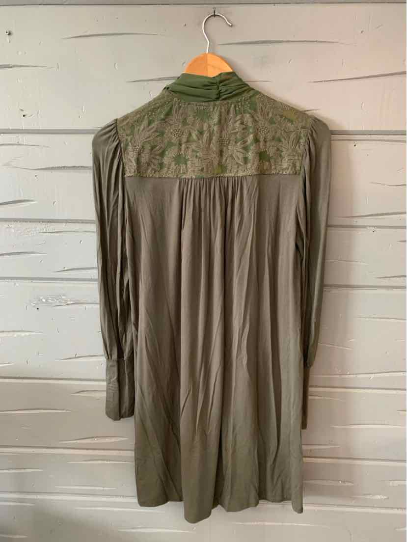 Olive green long-sleeve dress with embroidered yoke and gathered back pleats.