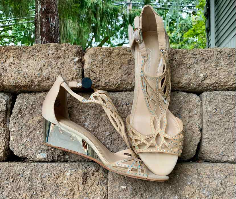 Tan wedge sandal with decorative bead detailing, ankle strap, and open toe design.