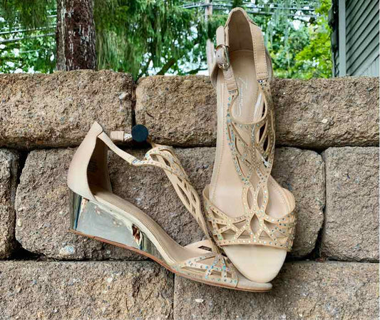 Tan wedge sandal with decorative bead detailing, ankle strap, and open toe design.