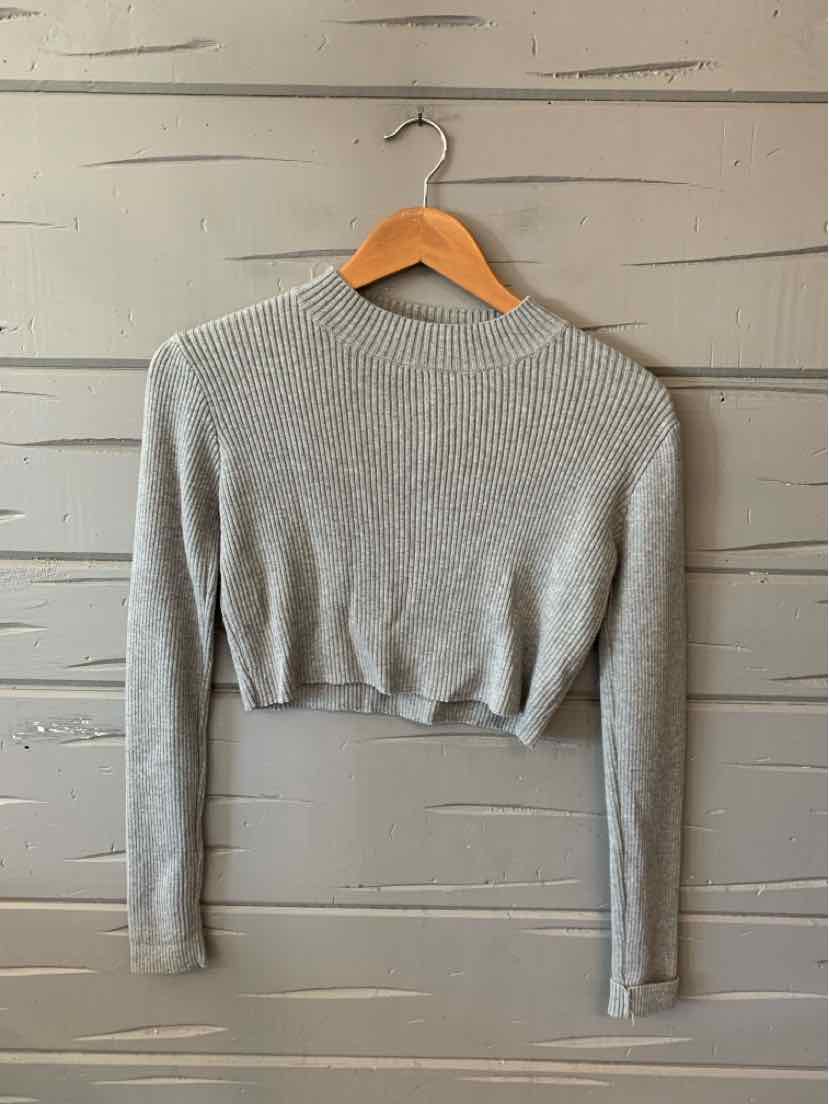 Light gray ribbed knit cropped sweater with long sleeves and a crew neckline.