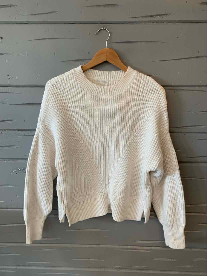 White ribbed knit sweater with crew neckline and long sleeves, size large.