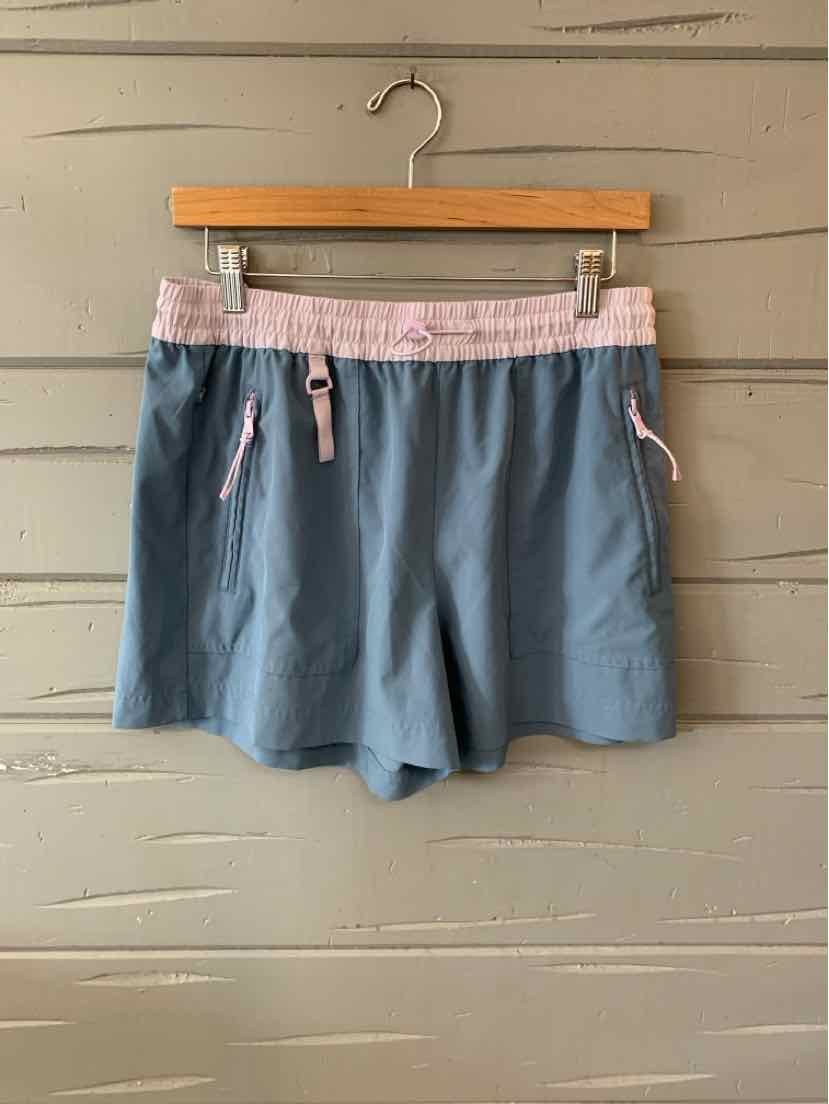 Light blue casual shorts with pink elastic waistband and adjustable drawstrings, relaxed fit.