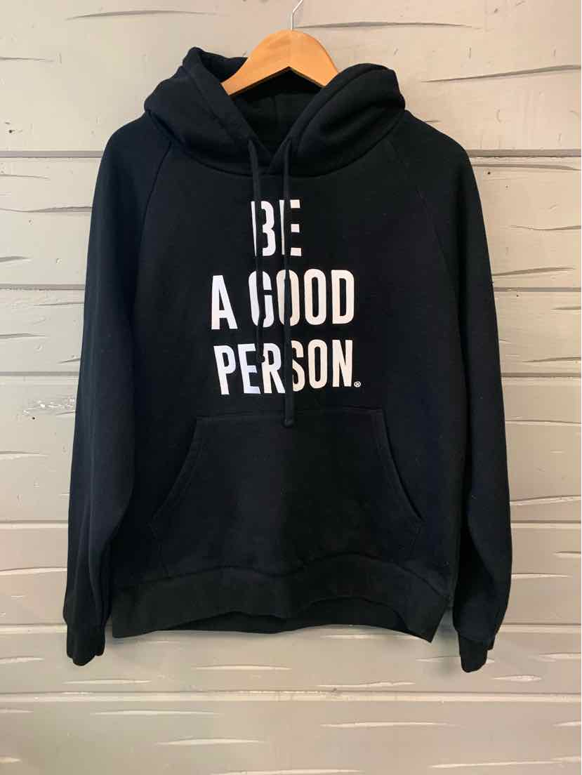 Black hoodie with white "BE A GOOD PERSON." text, front pocket and adjustable drawstrings.