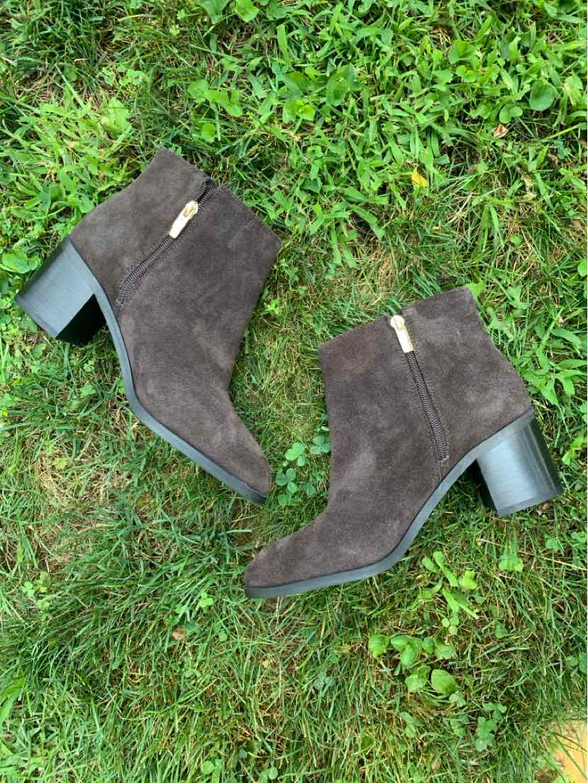 Dark brown suede ankle boots with block heels and side zippers.