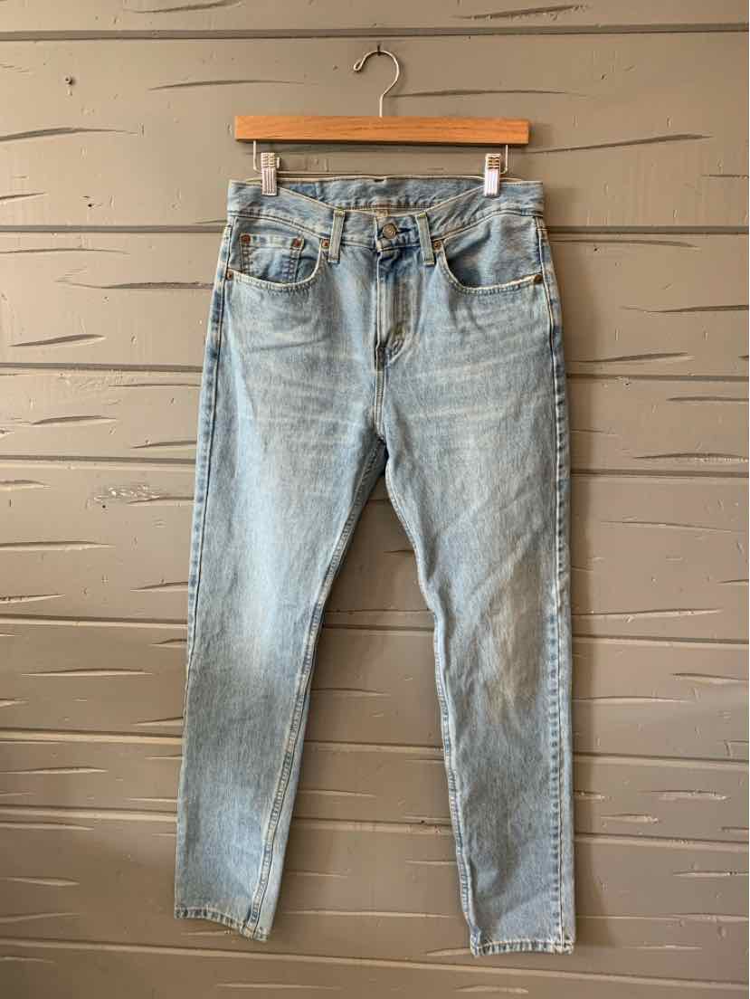 Light blue denim Levi's jeans with a classic five-pocket design and tapered legs, size 12.5.