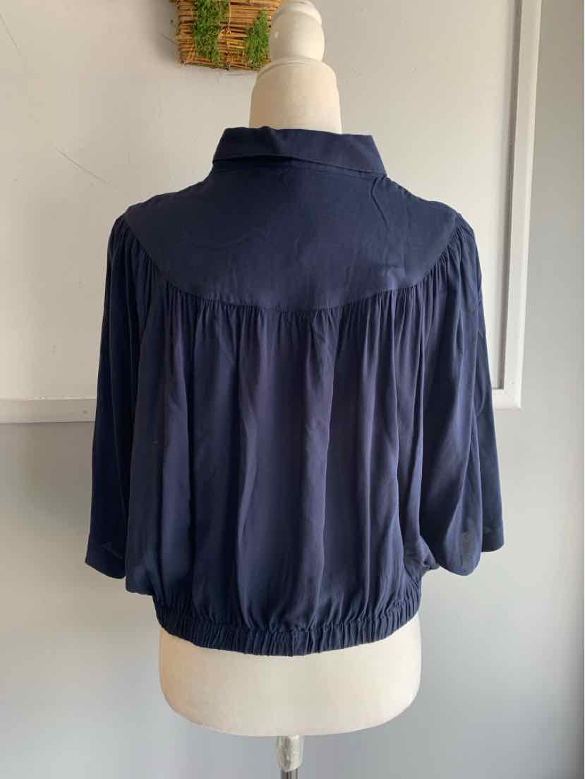 Navy blue lightweight blouse with gathered elastic hem and loose three-quarter sleeves.