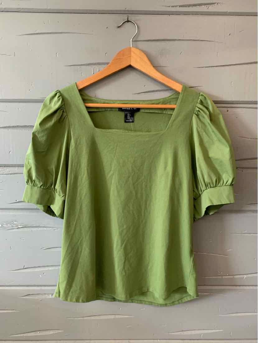 Light green short-sleeve blouse with puffed sleeves and square neckline on wooden hanger.