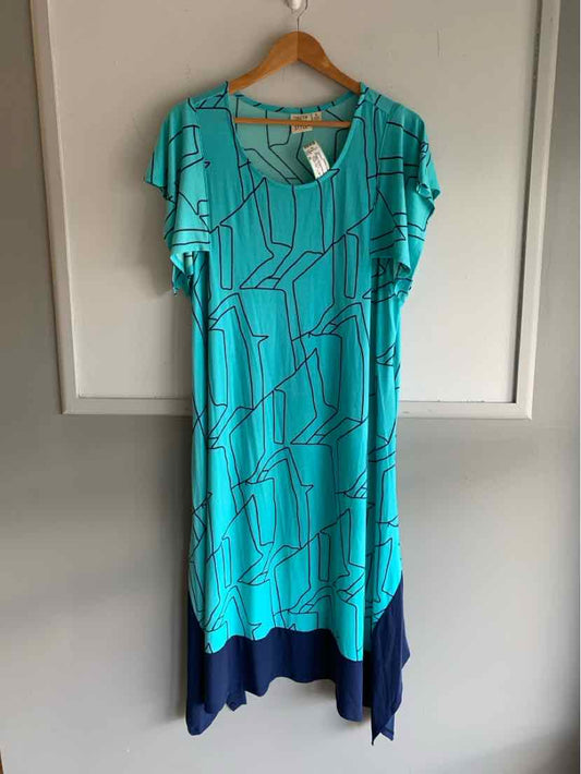 Teal knee-length geometric print dress with short sleeves and navy asymmetrical hem in size XL.