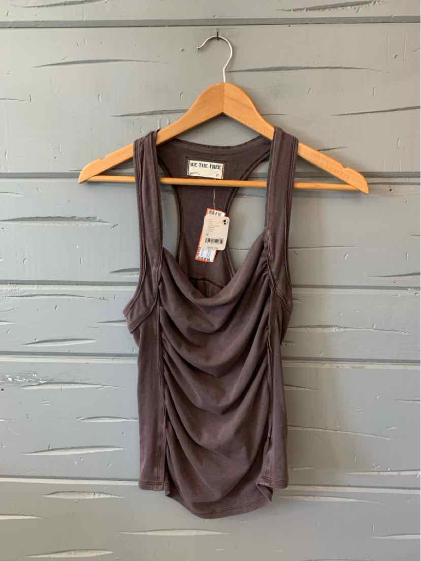 Charcoal gray sleeveless tank top with ruched front and wide straps hanging on wooden hanger.