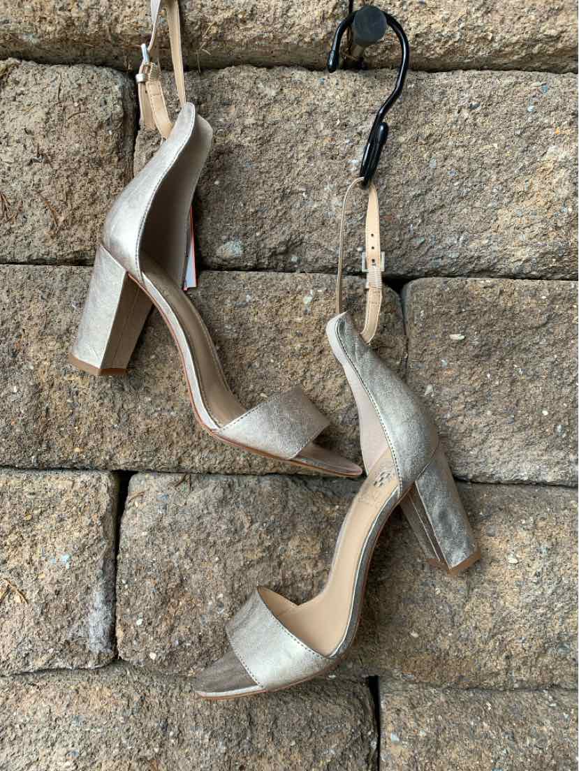 Metallic gold open-toe block heels with ankle straps and suede texture, size 7.