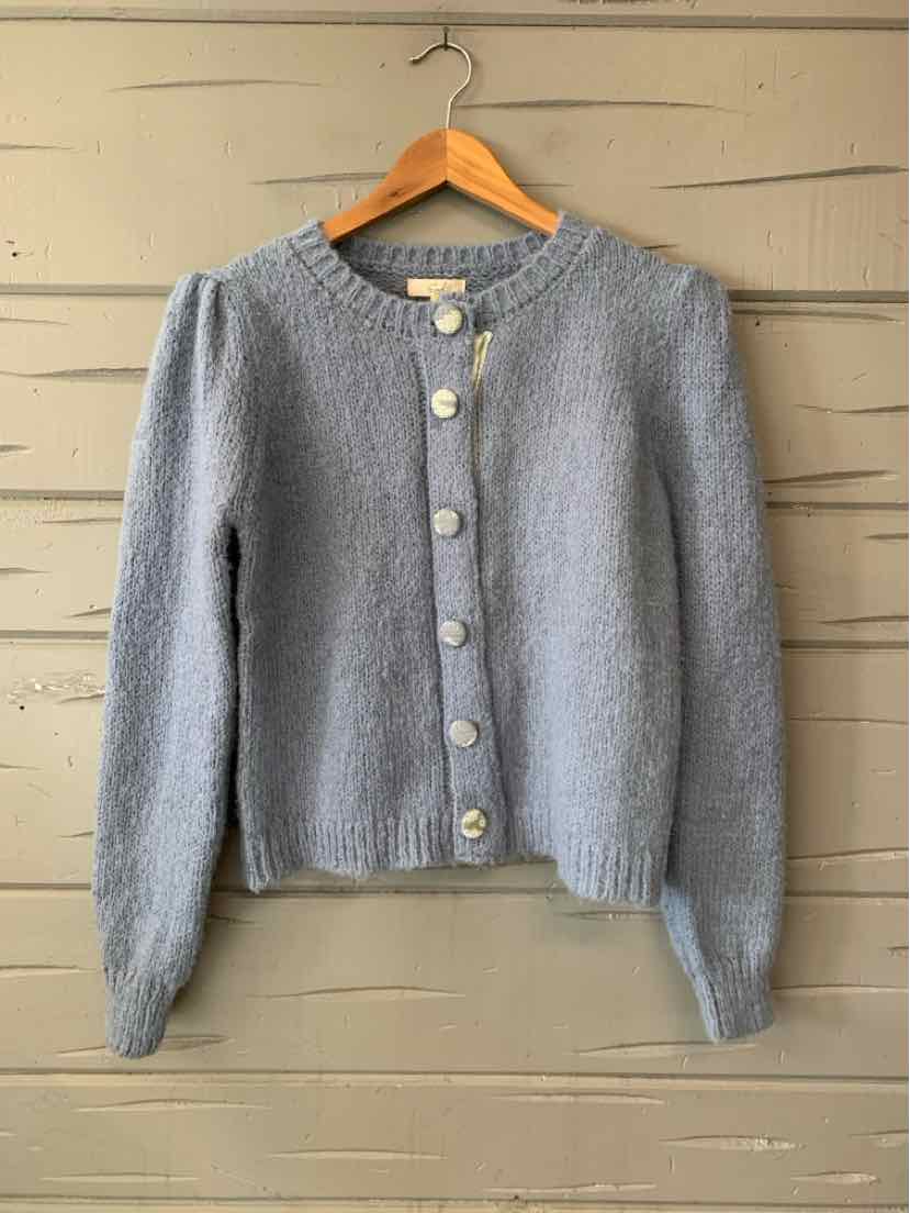 Women’s gray knit cardigan with a round neckline, long sleeves, and large decorative buttons.