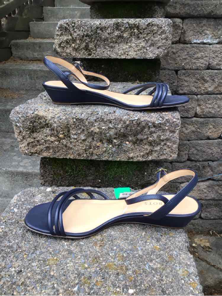 Navy blue leather sandal with low wedge heel and multiple front straps, size 9.5.