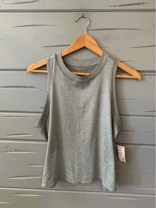 Gray sleeveless athletic tank top with crew neck, lightweight fabric, and straight hem.