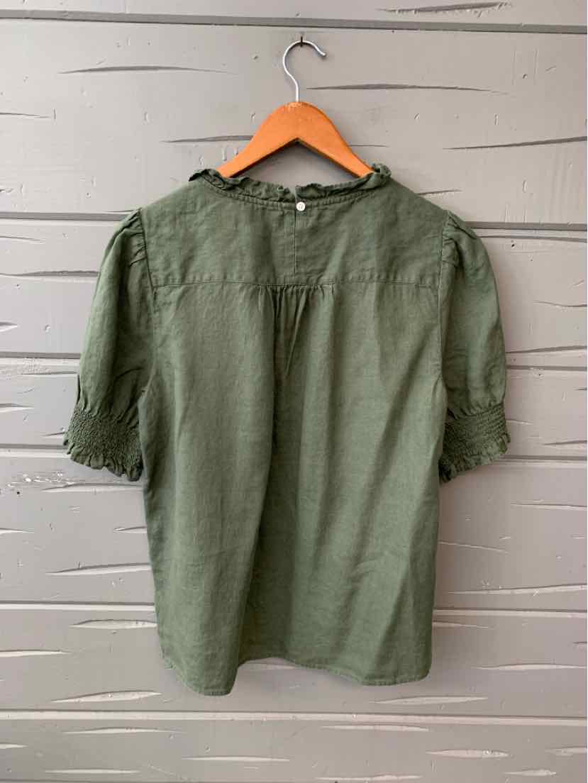 Olive green linen short-sleeve blouse with a loose fit and button detail at the back neck.