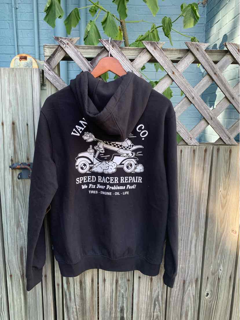 Black hoodie with white vintage motorcycle graphic and "Vans Co Speed Racer Repair" text on back.