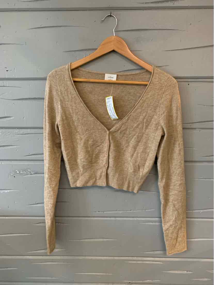 Tan long-sleeve cropped cardigan with V-neck and fitted silhouette on wooden hanger.