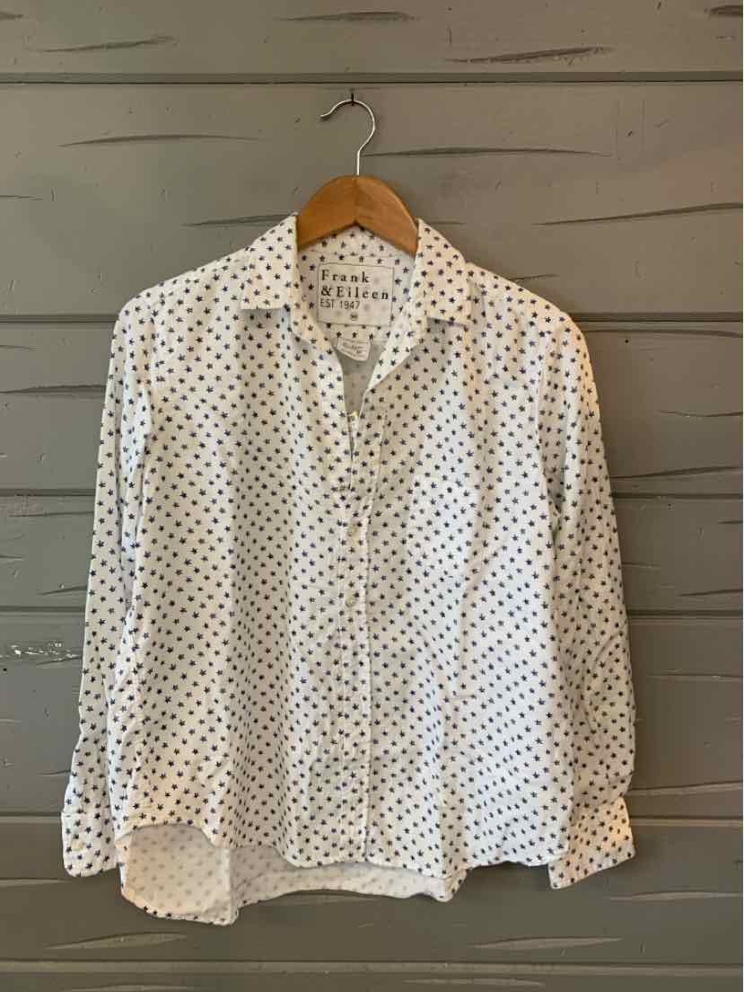 White button-up shirt with black star print, long sleeves, and classic collar, size XS.