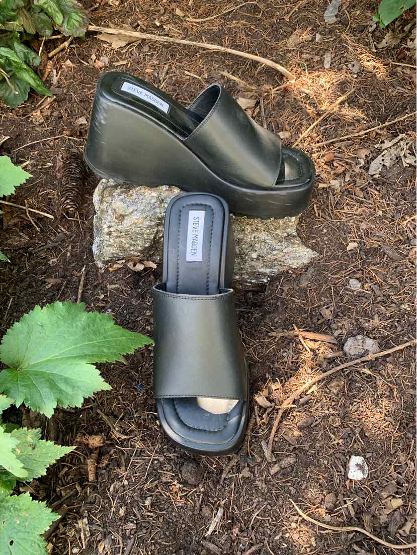 Black platform wedge sandals with slip-on design and open toe, size 8.5.