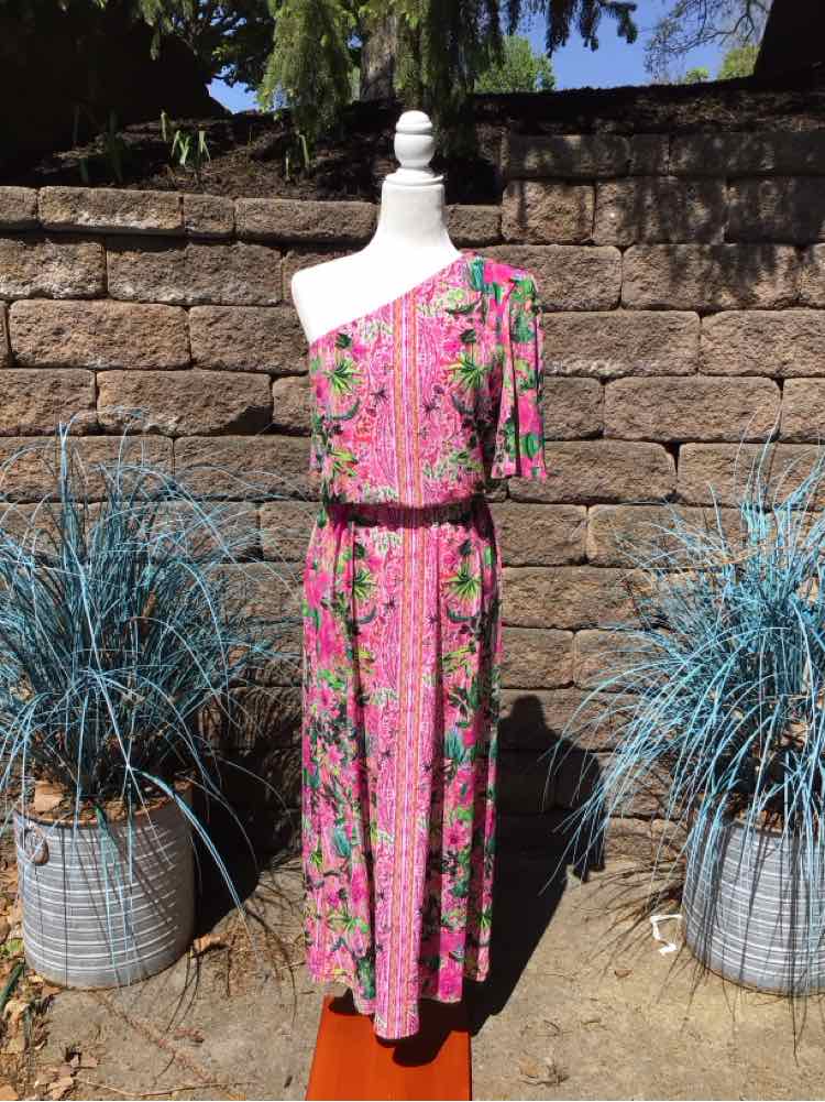 Pink floral one-shoulder maxi dress with a cinched waist and short sleeve on left side.