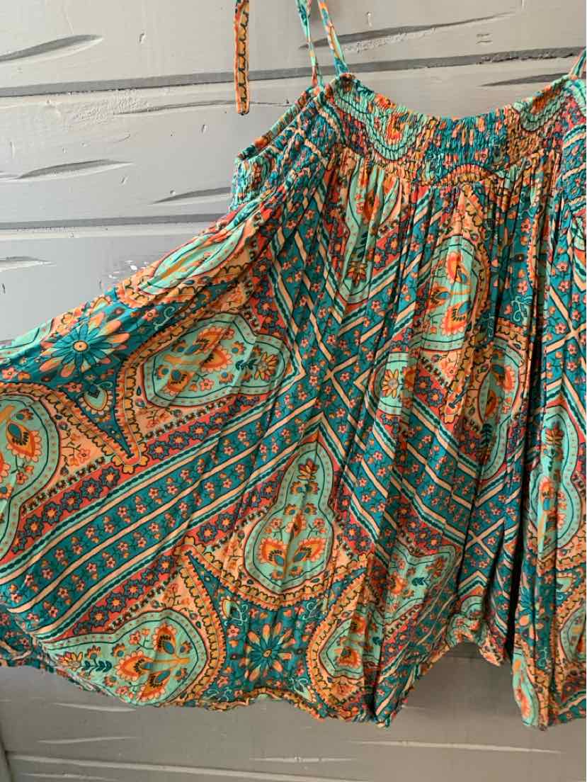 Loose boho blouse in teal and orange paisley print with gathered neckline and thin shoulder straps.