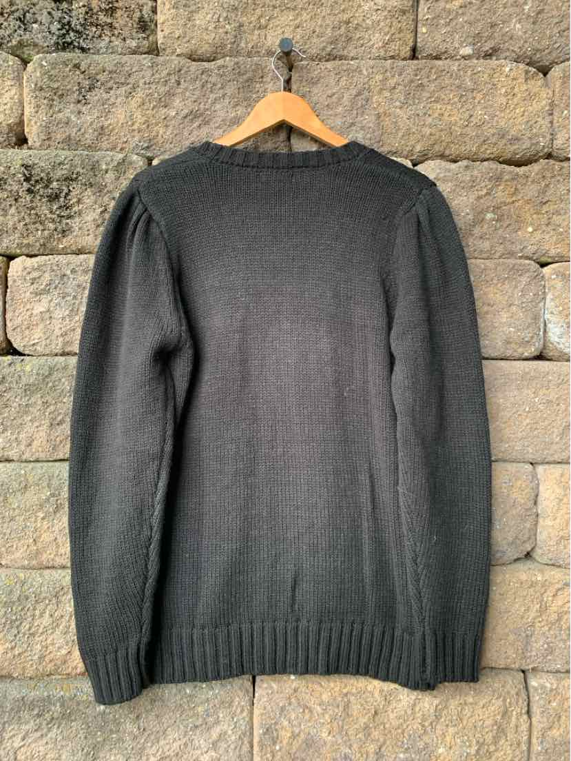 Black women’s Elan crewneck sweater with long sleeves, ribbed cuffs and hem, and a relaxed fit.