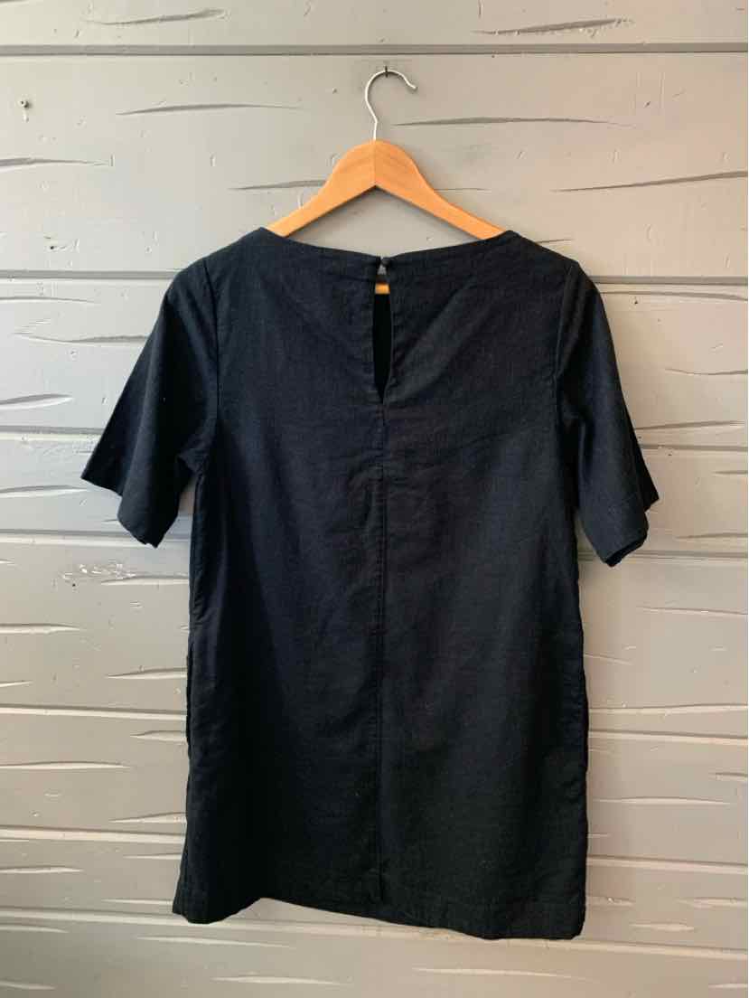 Black short-sleeve dress with back button detail, medium size, smooth fabric.