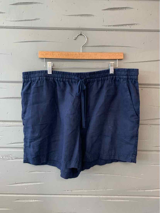 Navy blue solid swim trunks with elastic waistband and drawstring, casual style.