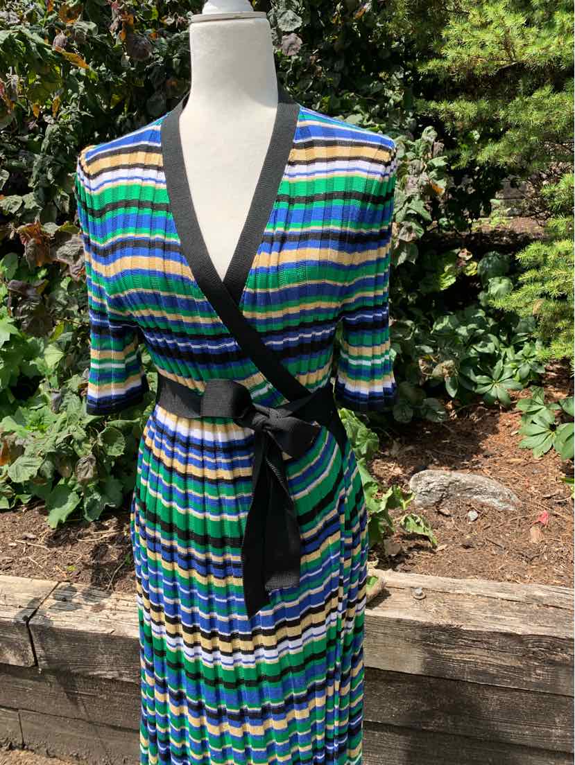 Knit wrap dress with blue, green, white, and black horizontal stripes, V-neck, and black waist tie.
