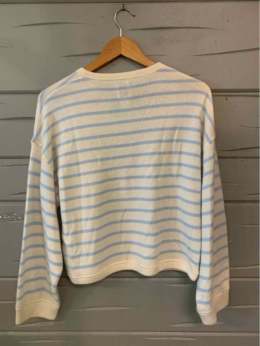 Light beige long-sleeve sweater with horizontal pale blue stripes and ribbed cuffs.