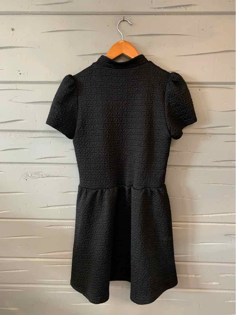 Black short-sleeve dress with textured fabric, fitted waist, and slightly flared skirt.