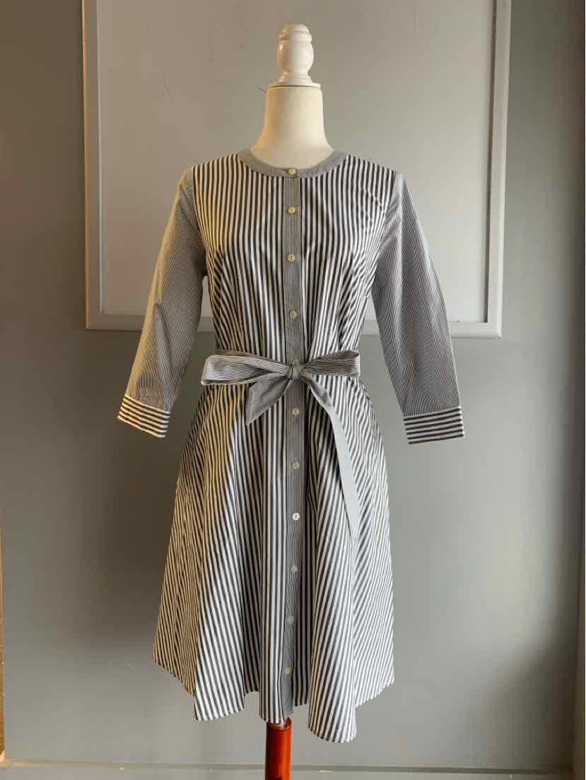 Gray and white striped button-front dress with three-quarter sleeves and a waist tie belt.