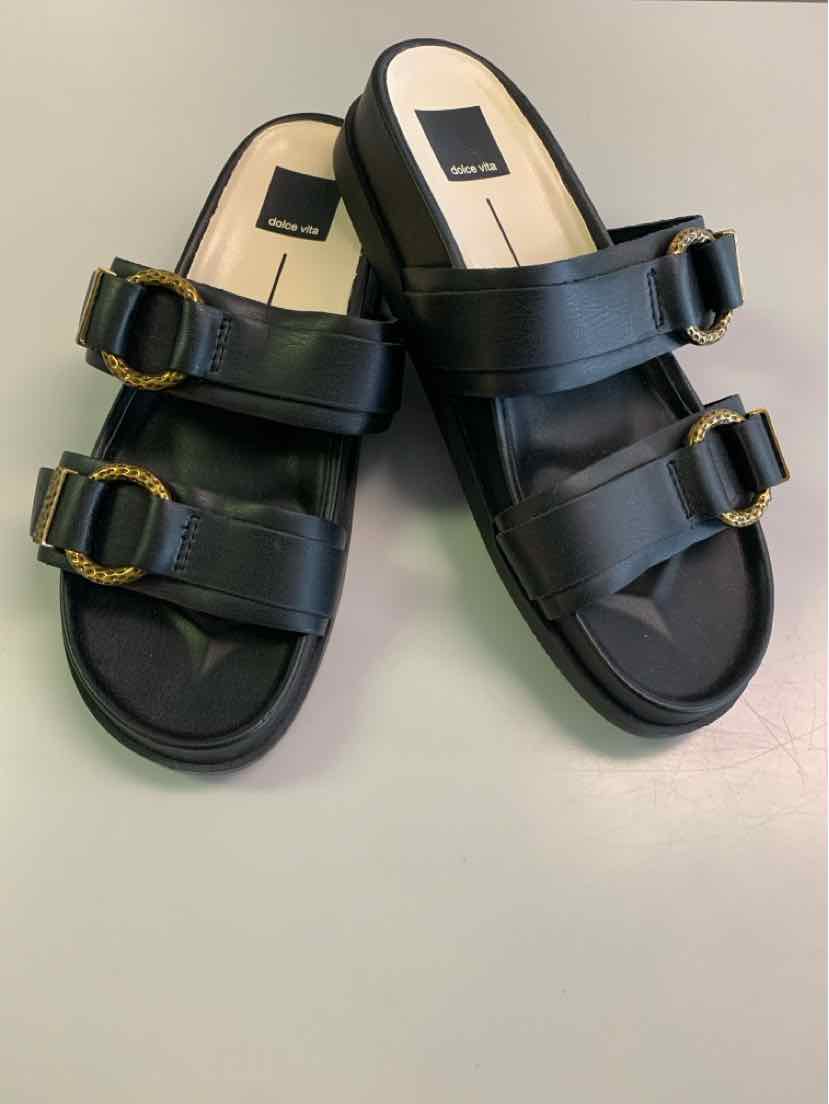 Black leather slide sandals with double adjustable buckle straps and cushioned footbed, size 8.