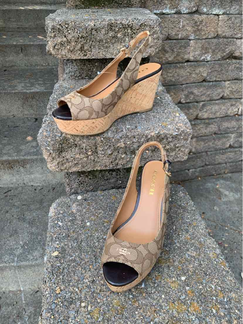 Women's Coach wedge sandals size 7.5 in brown monogram canvas with peep toe and slingback strap.
