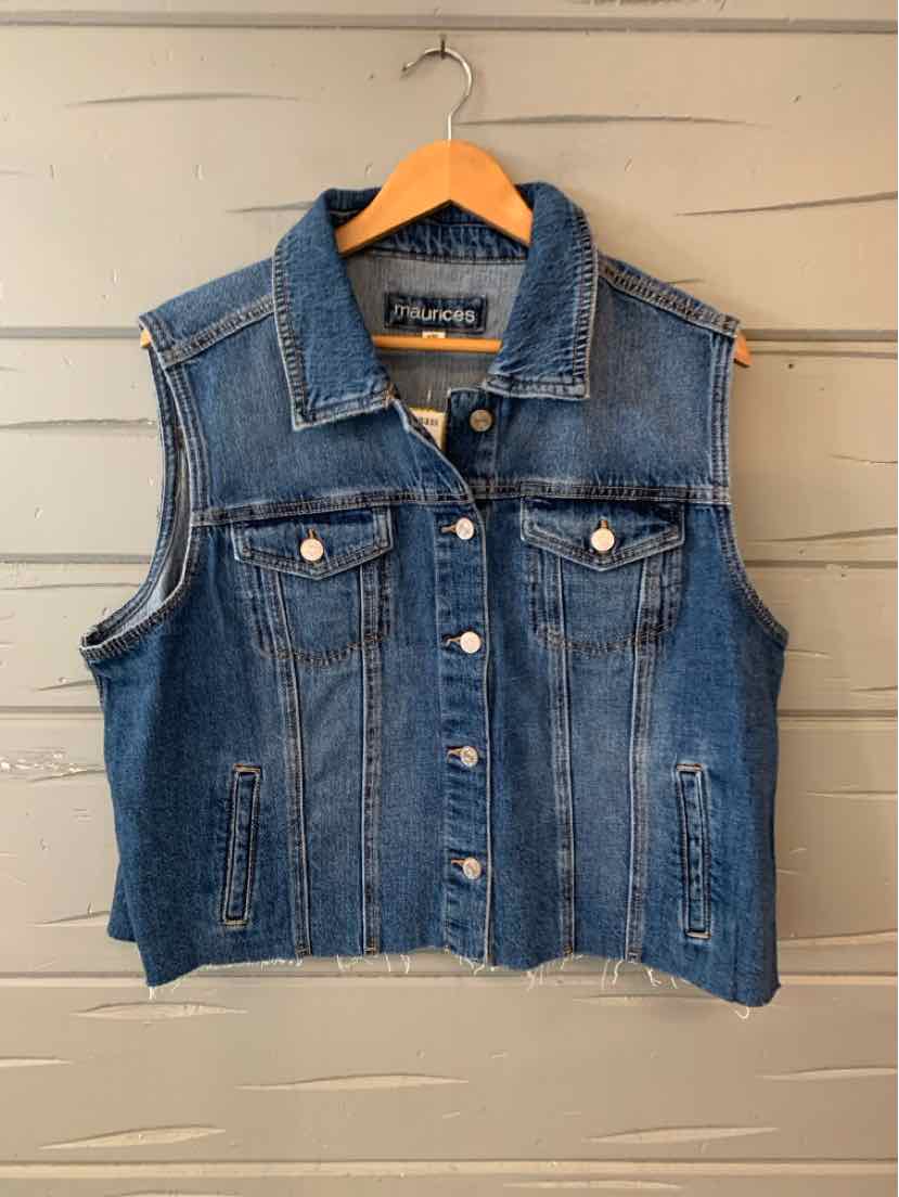 Sleeveless blue denim vest with button front and two chest pockets on wooden hanger.