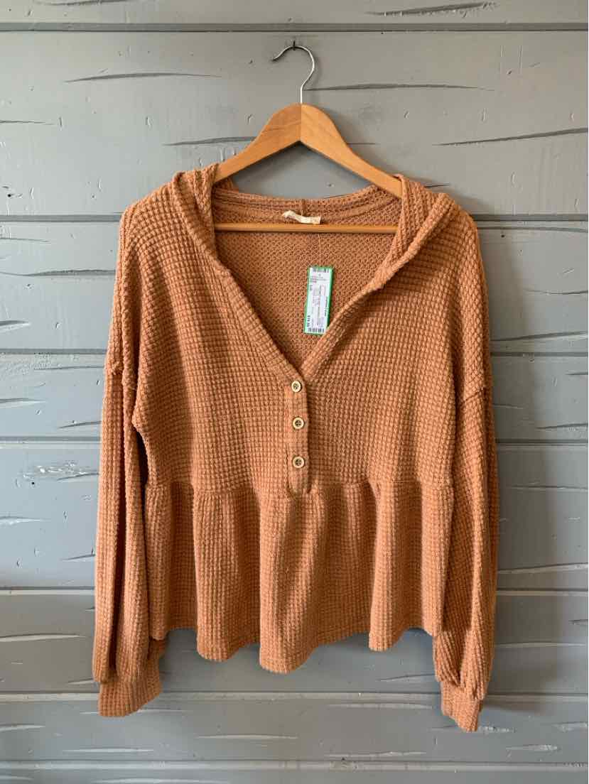 Tan long-sleeve waffle knit top with henley neckline and gathered peplum hem, size large.