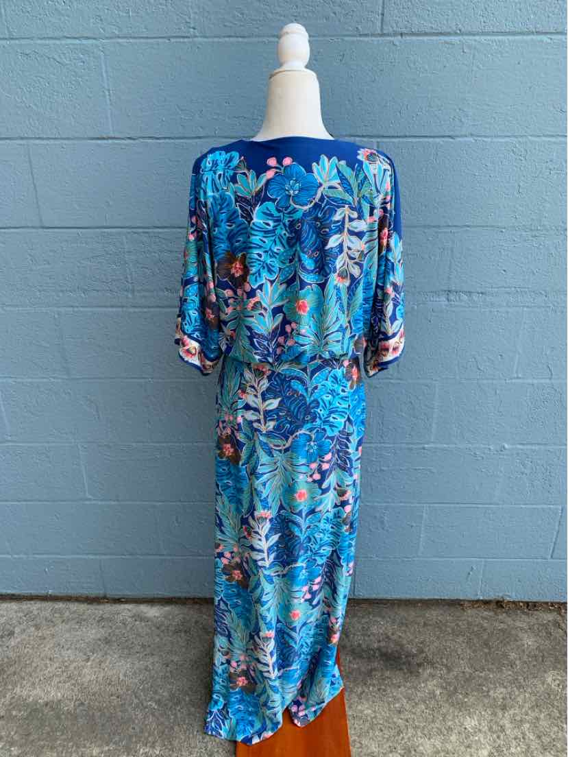 Blue tropical print midi dress with 3/4 puff sleeves and relaxed fit.