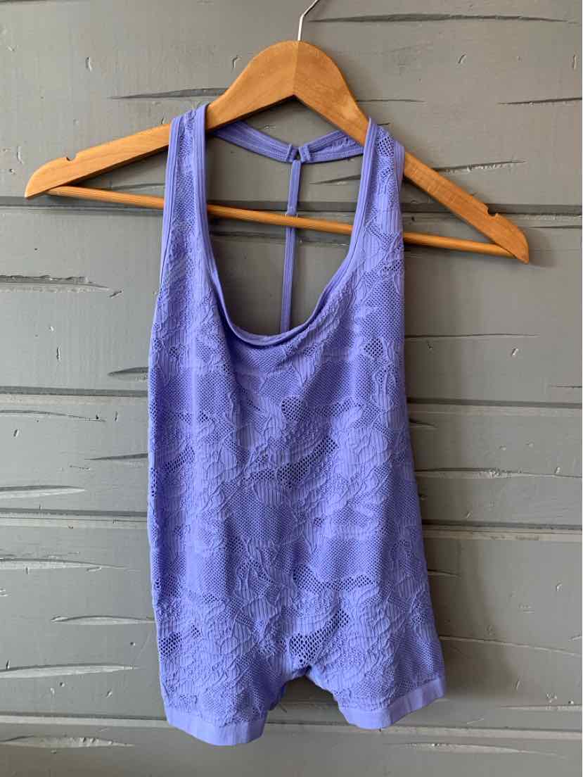Lavender sleeveless tank top with subtle textured pattern and scoop neckline on wooden hanger.