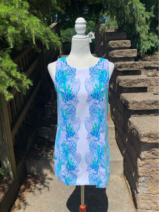 Sleeveless knee-length dress with blue and green floral pattern on light lavender fabric.