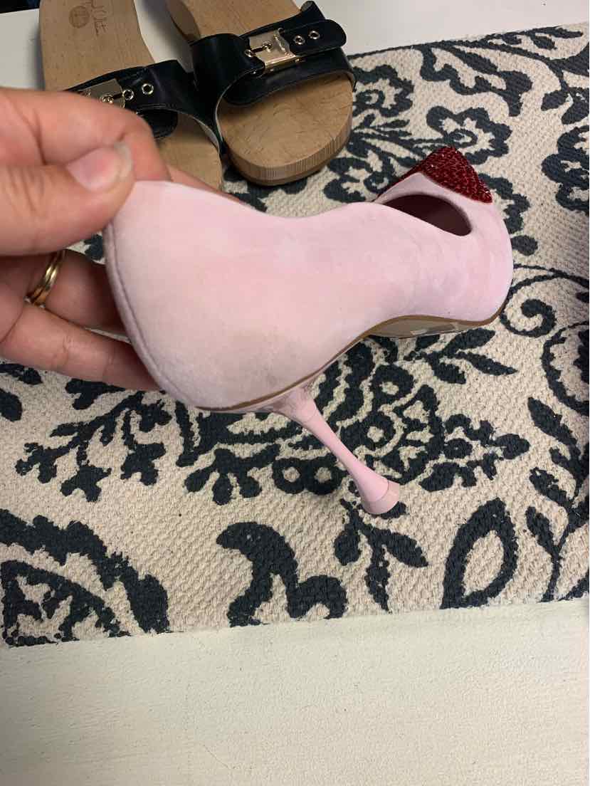 Light pink suede high-heeled shoe with pointed toe and slim stiletto heel.