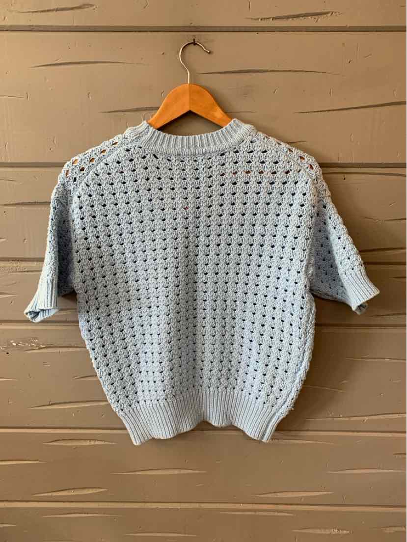 Light blue knit short-sleeve sweater with a textured openwork pattern and ribbed hem and cuffs.