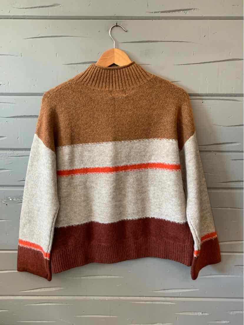 Brown, cream, and rust color-blocked knit sweater with a mock neck and long sleeves.