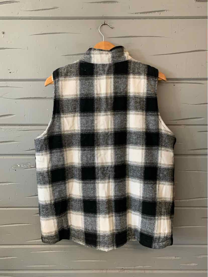 Women’s black, gray, and white plaid sleeveless vest with a button-front closure and stand collar.